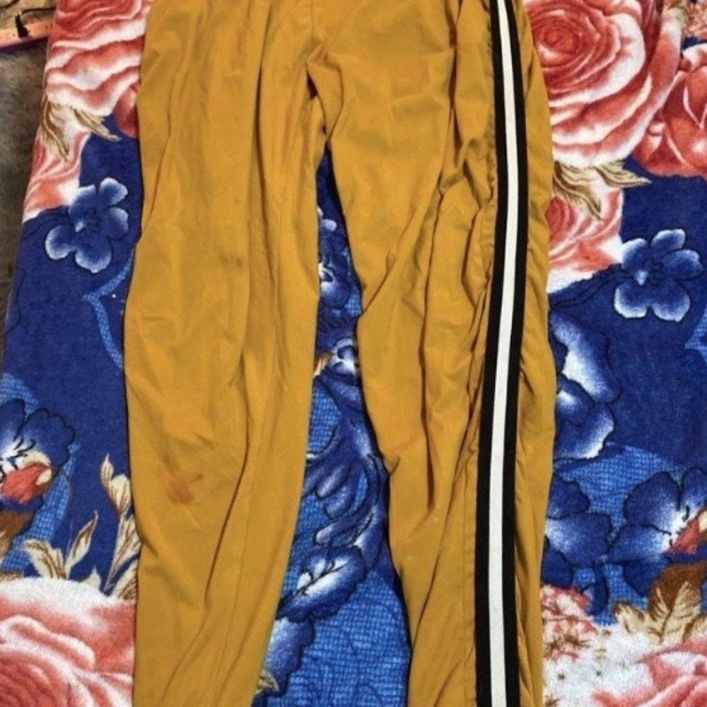Yellow track pants with stripe